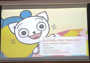 Ekran filmowy z bohaterką filmu pt. "Kicia Kocia mówi dzień dobry".